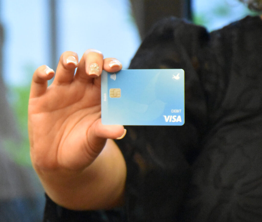 Member holding an LCCU debit card