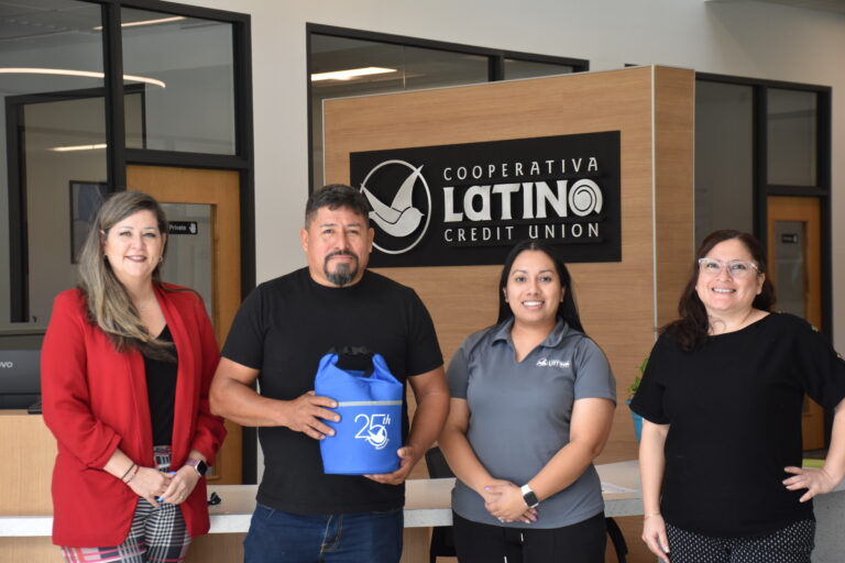 Sabino with staff members at the Fayetteville branch