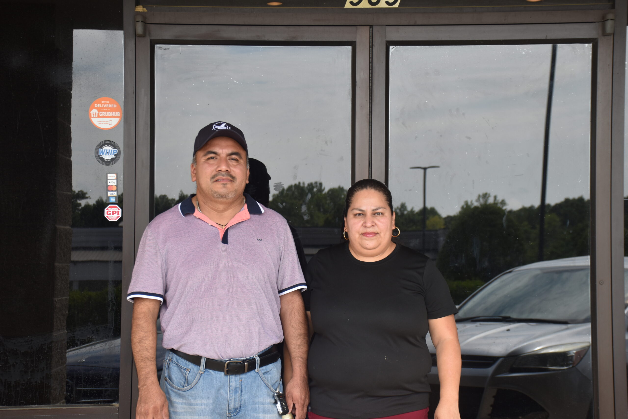 members cornelio and wife outside their restaurant