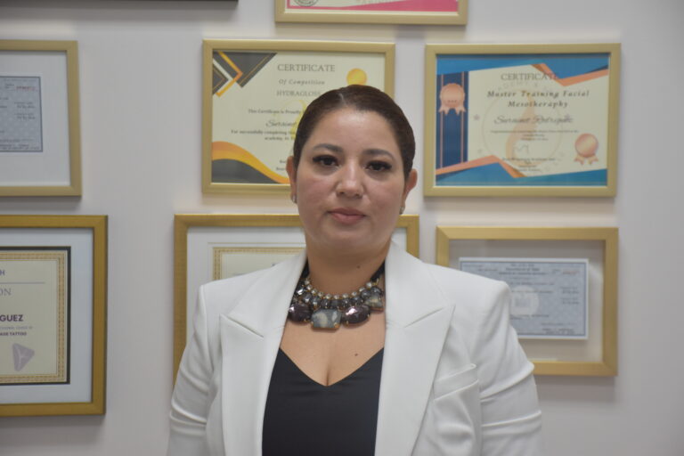 member Surainet with her certificates