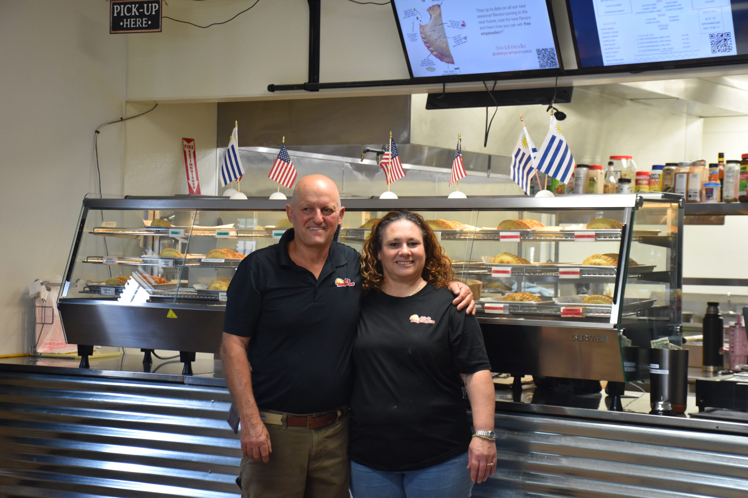 Member Alberto and wife in their restaurant