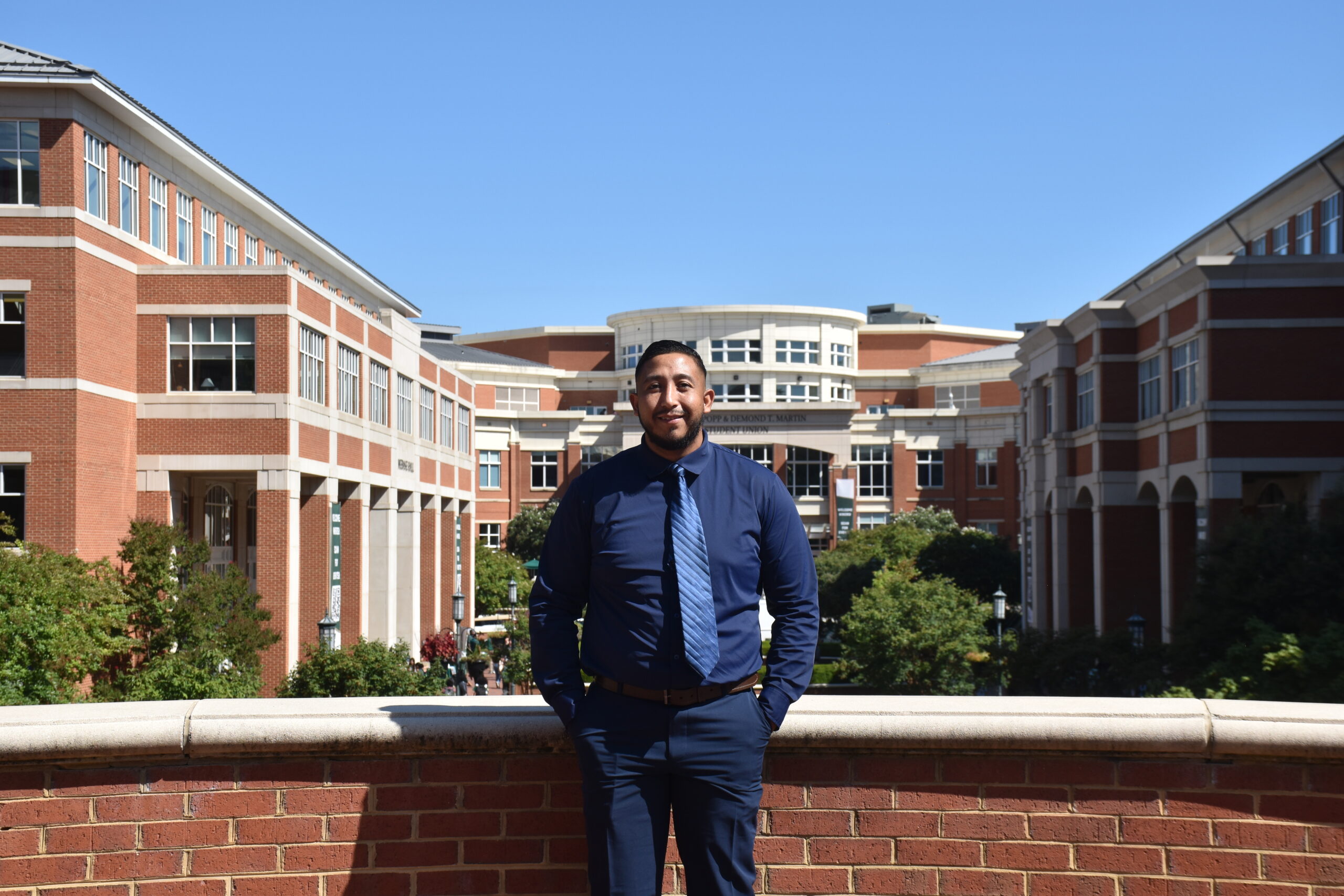 member and employee Jose outside UNC Charlotte campus